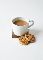 a mug of brown liquid, plus two biscuits